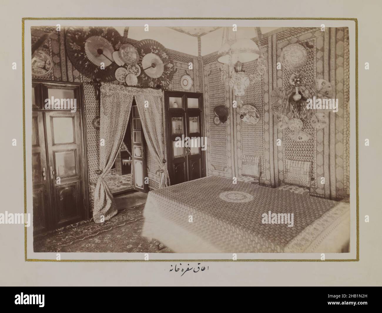 One of 274 Vintage Photographs, Photograph, late 19th-early 20th century, Qajar, Qajar Period, image: 6 1/2 x 9 1/16 in., 16.5 x 23 cm, curtains, decorative, furniture, pattern, persian rug, persian script, room Stock Photo