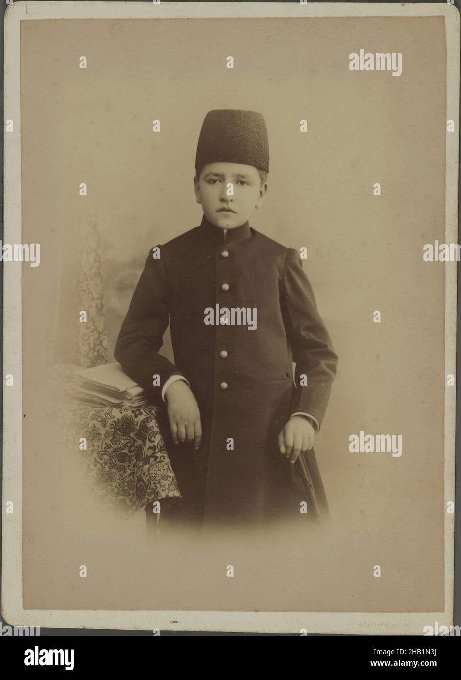 One of 274 Vintage Photographs, Photograph, late 19th-early 20th century, Qajar, Qajar Period, 5 13/16 x 4 5/16 in., 14.8 x 11 cm, boy, child, photograph, photography, portrait, Qajar, studio Stock Photo