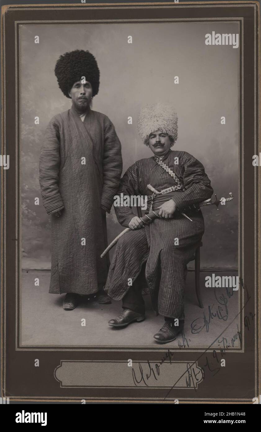 Two Khans in Turkoman Tribal Costume, One of 274 Vintage Photographs, Silver matte collodion photograph, 1912, Qajar, Qajar Period, 6 5/8 x 4 5/16 in., 16.8 x 11.0 cm, cartes de visite, costume, historical fashion, Kahn, Middle East, photograph, portrait, studio, Tribal Costume, Turk, Turkey Stock Photo