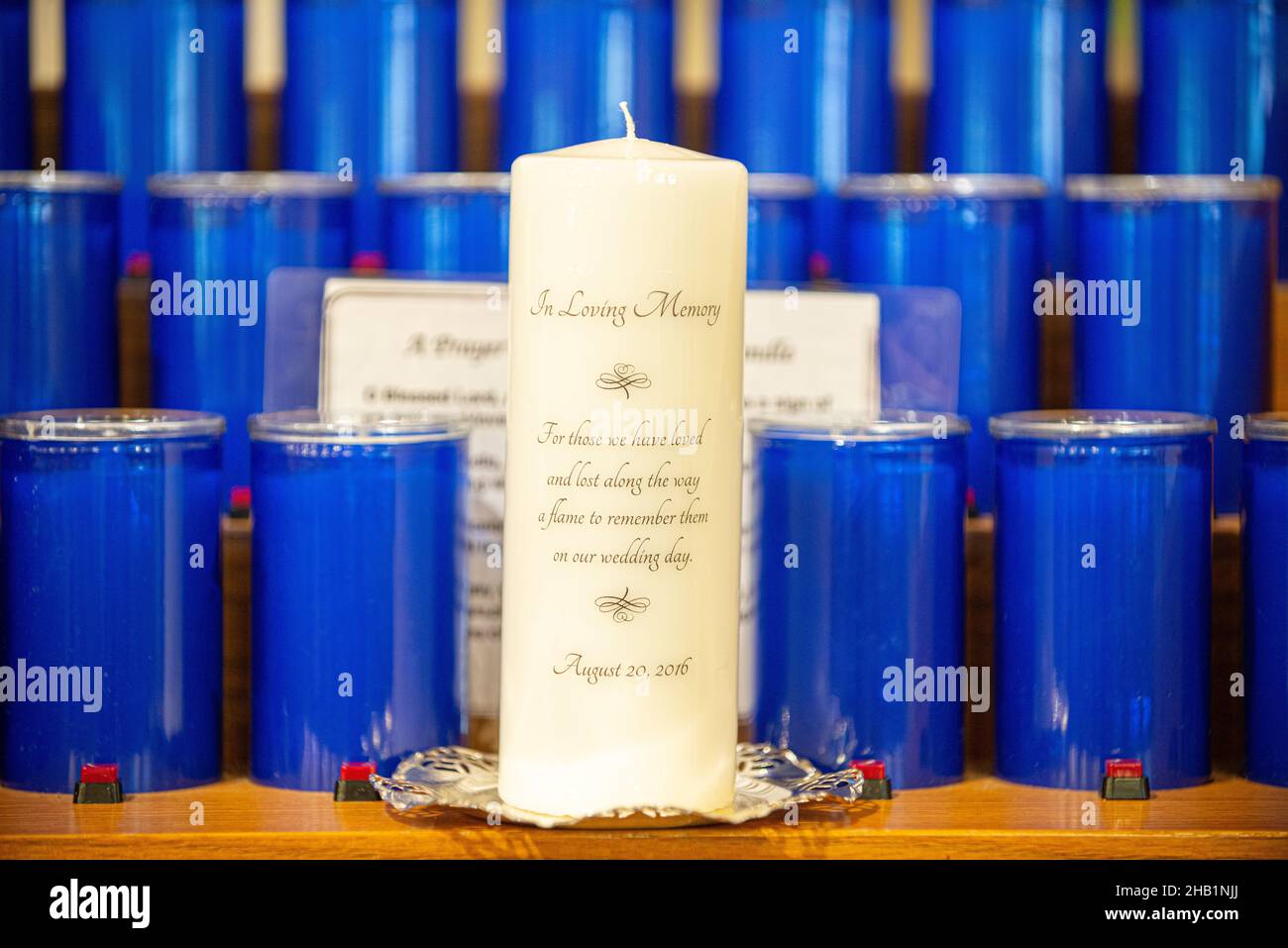 lue and white candles at altar athouse of worship Stock Photo Alamy