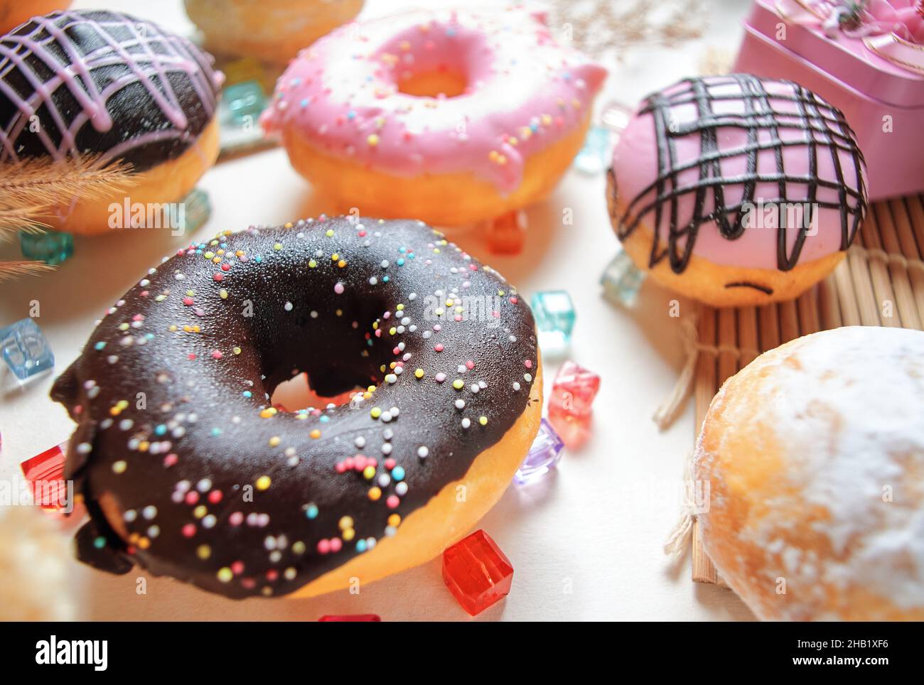 The various colors and taste glazed donuts on the table Stock Photo