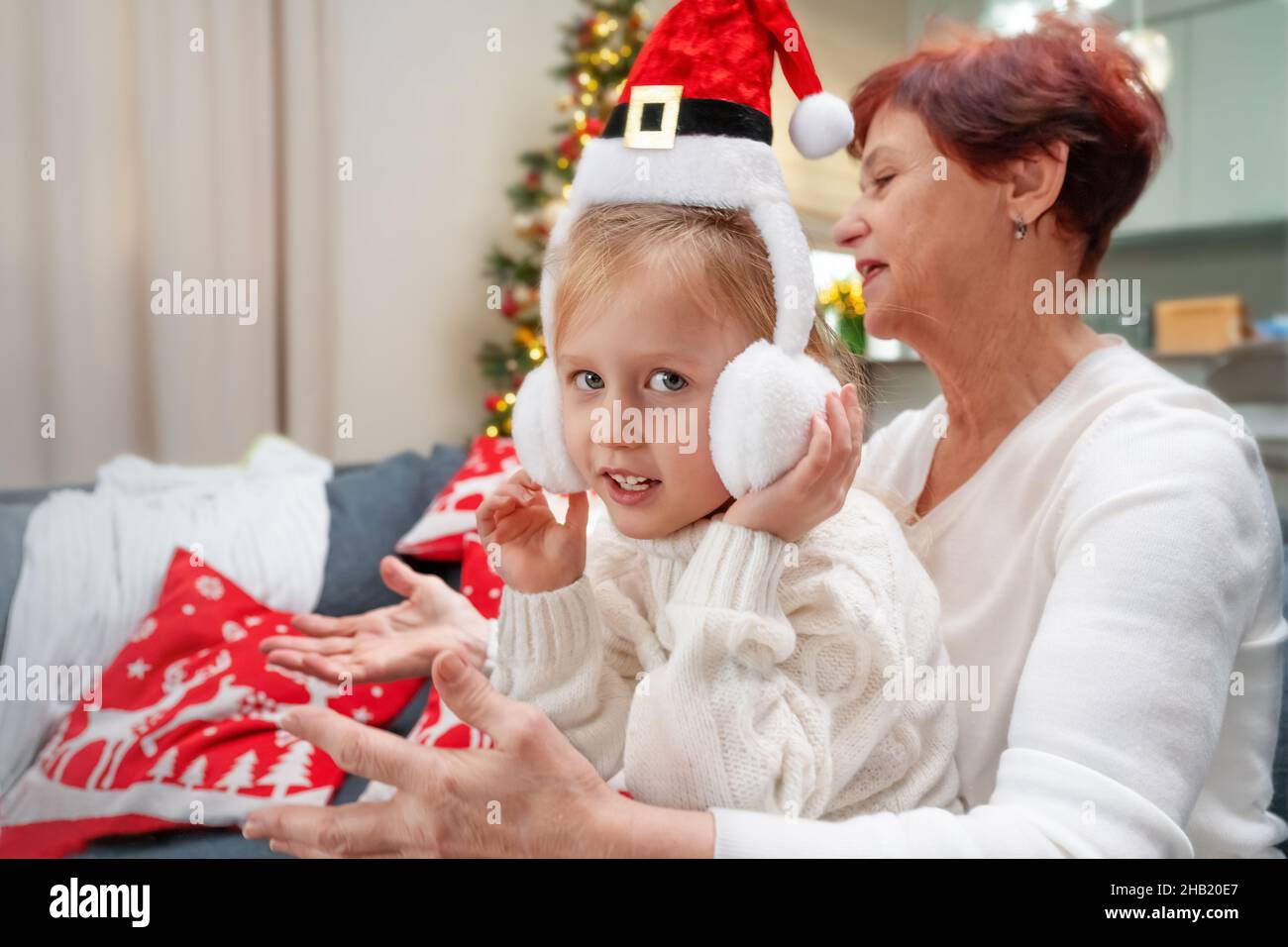 grandma and granddaughter together for merry christmas Stock Photo
