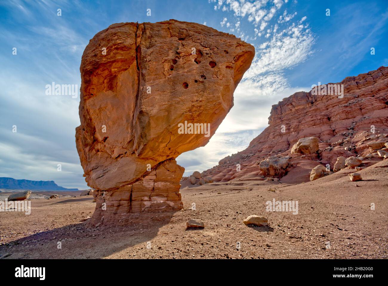 Balanced boulders at the base of Vermilion Cliffs in Glen Canyon Recreation Area Arizona. Stock Photo