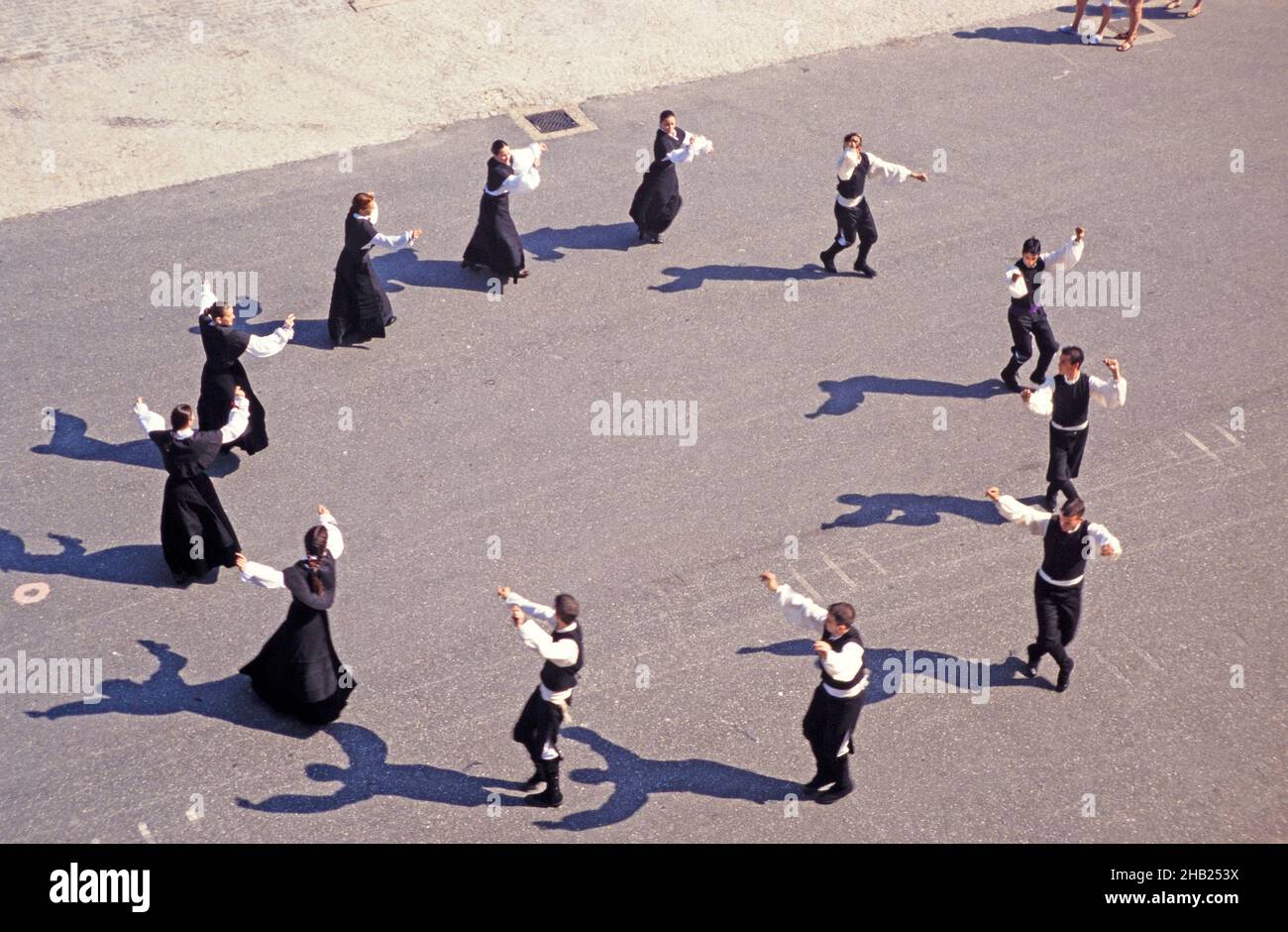 Traditional folk dancers perform on the quayside for cruise ship audience, Vigo, Spain Stock Photo