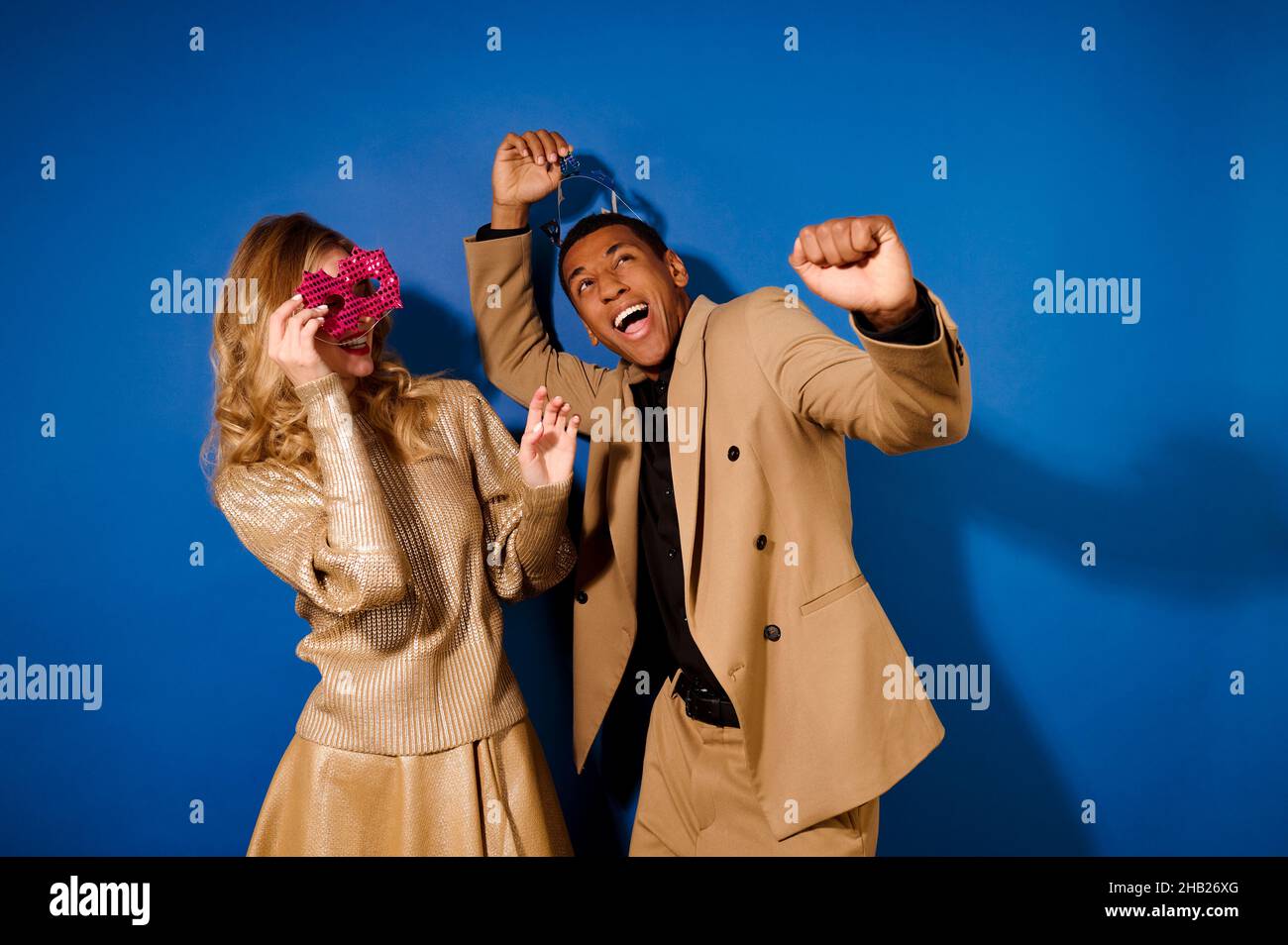 Enthusiastic energetic guy and girl with mask Stock Photo