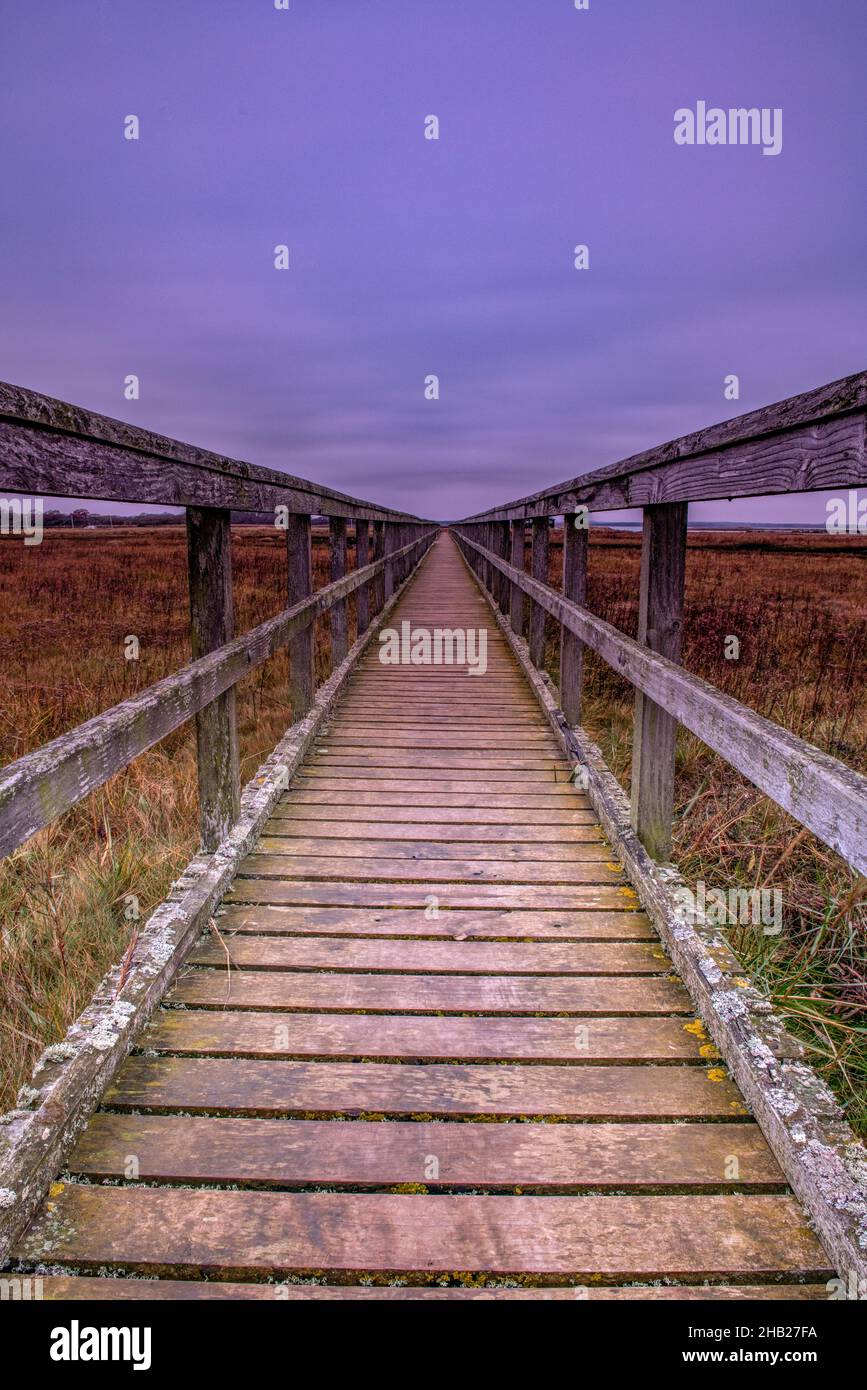 wooden walkway over marshes at newtown creek on the isle of wight