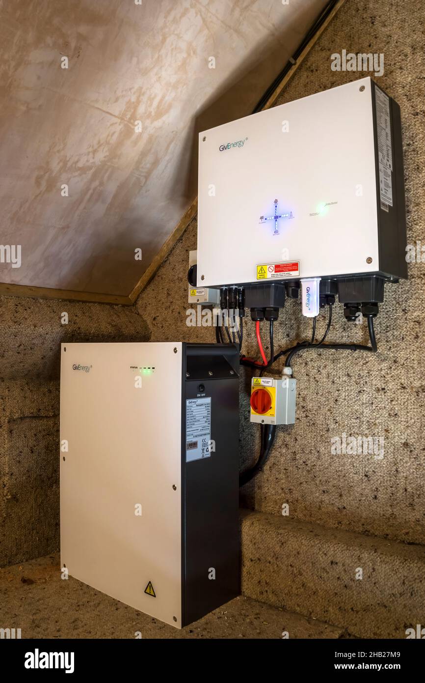 Givenergy inverter and battery in loft of house with solar panels. Converts DC power to AC & supplies to house, stores in battery or exports to grid. Stock Photo