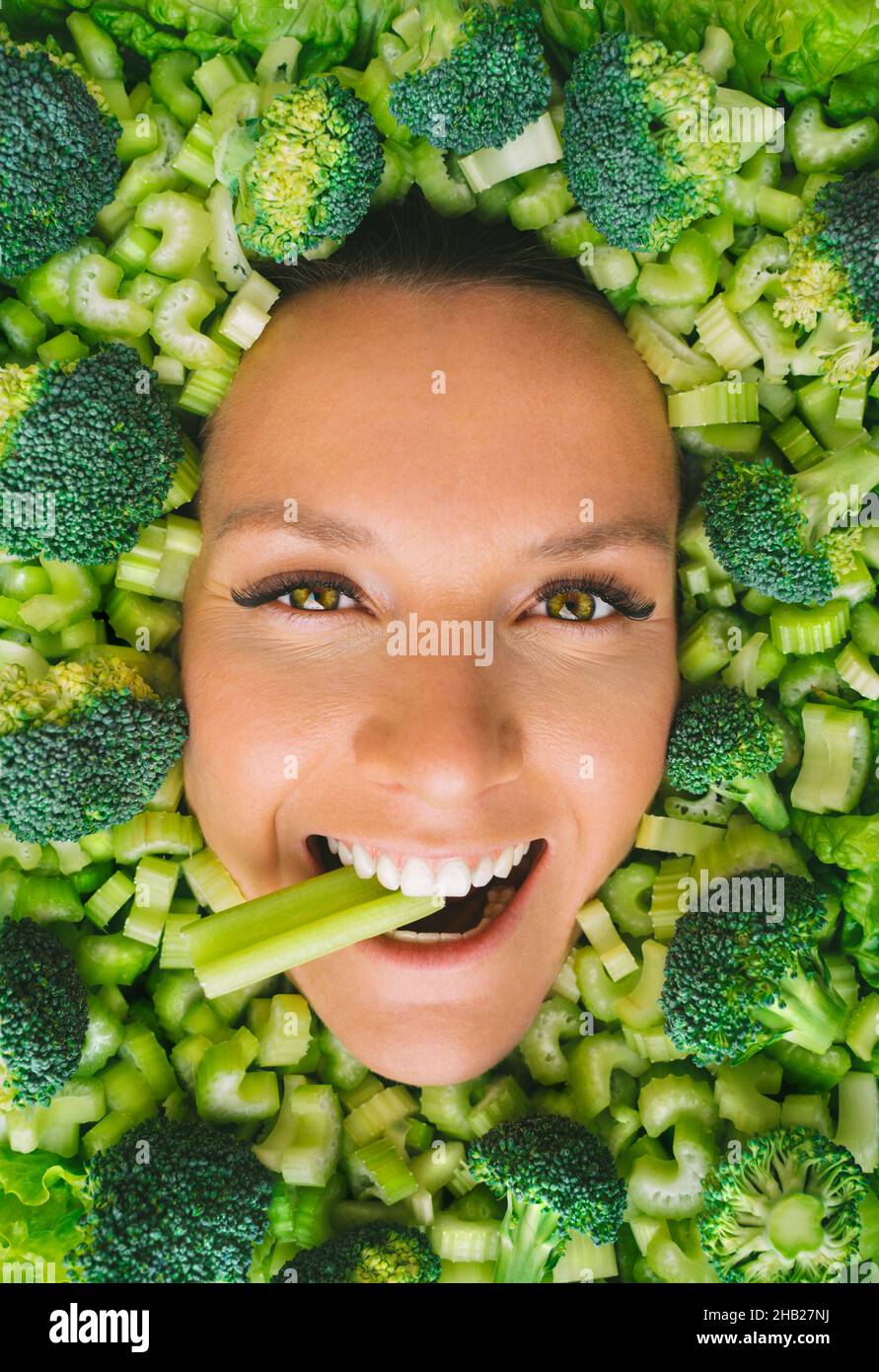 Young woman with vegetables. Eating healthy food concept Stock Photo