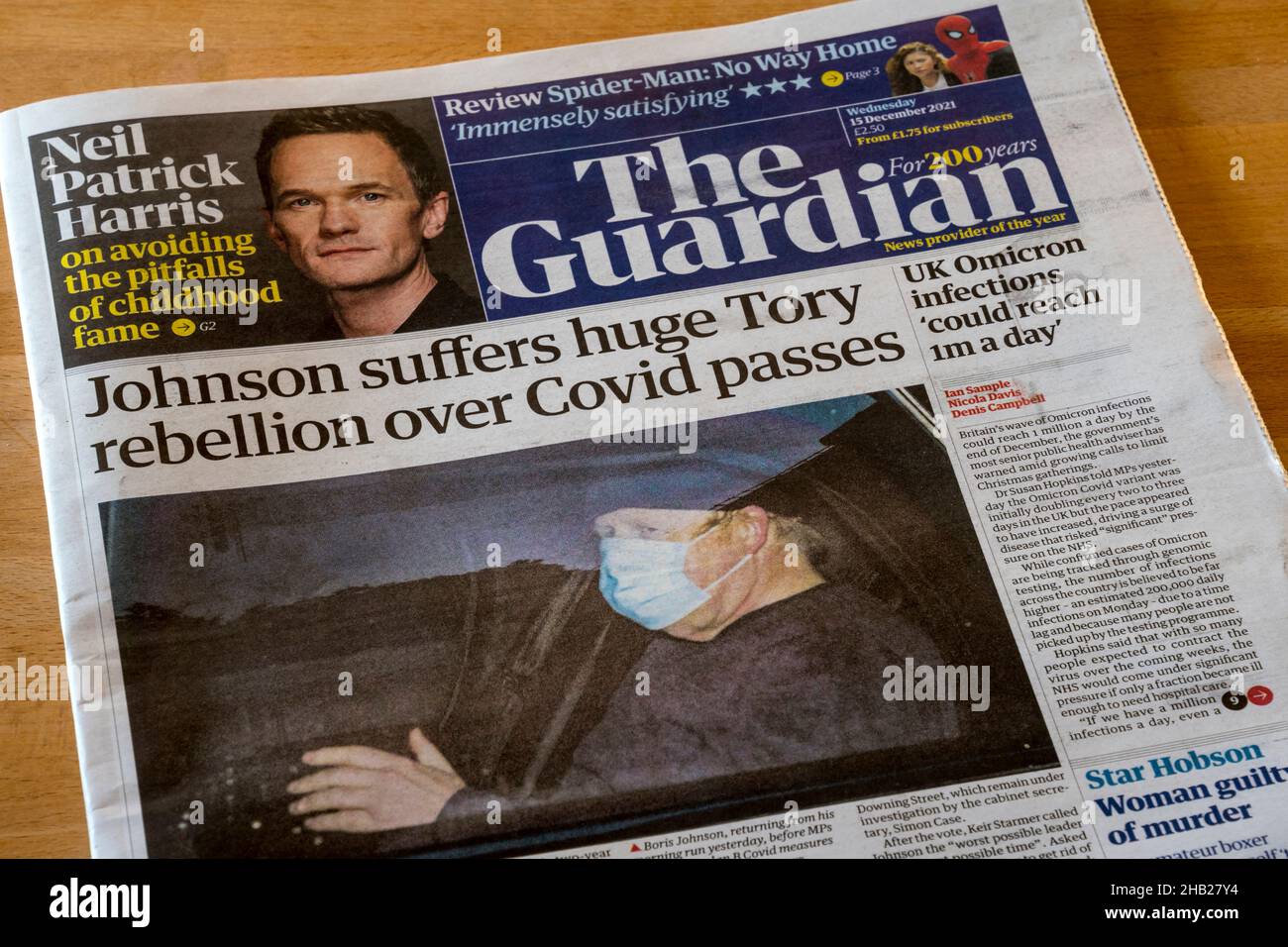 Guardian front page headline of 15 December 2021 reads Johnson suffers huge Tory rebellion over Covid passes. Stock Photo