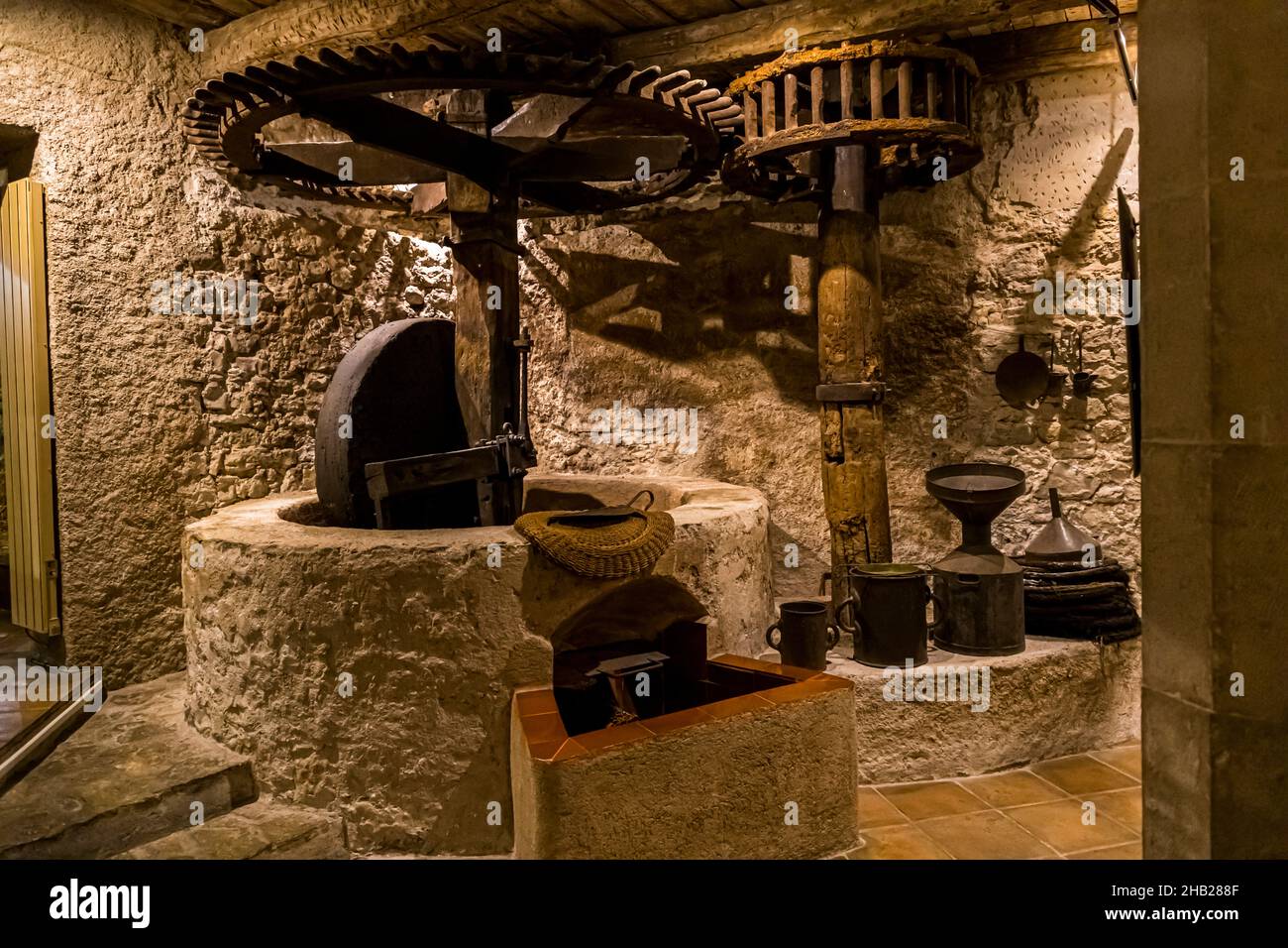 Traditional olive oil press in the museum of Arts & Traditions Populaires in Draguignan, France Stock Photo