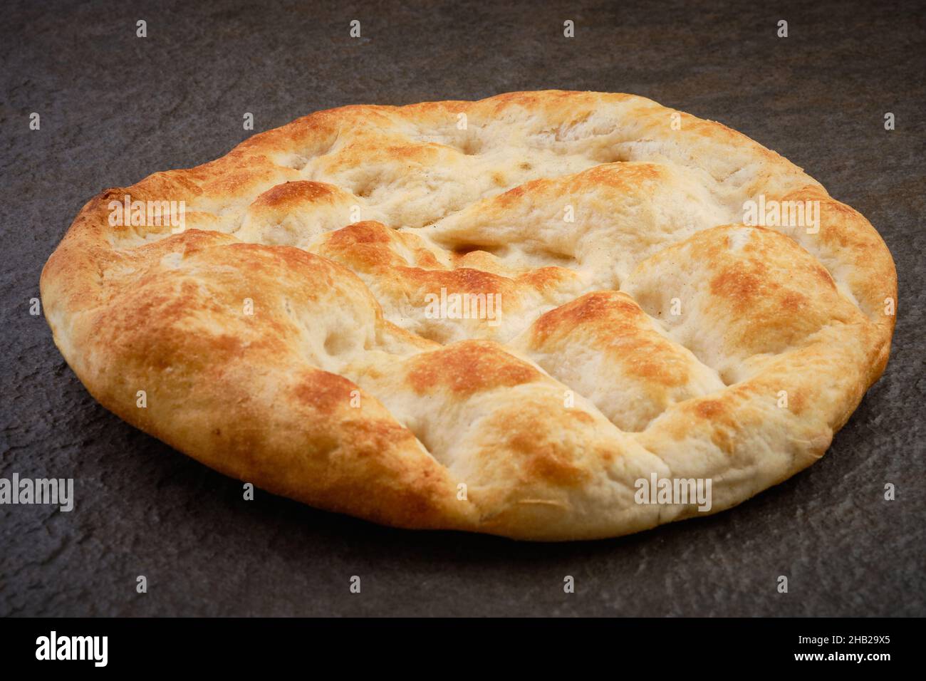 Pita bread on stone table surface Stock Photo