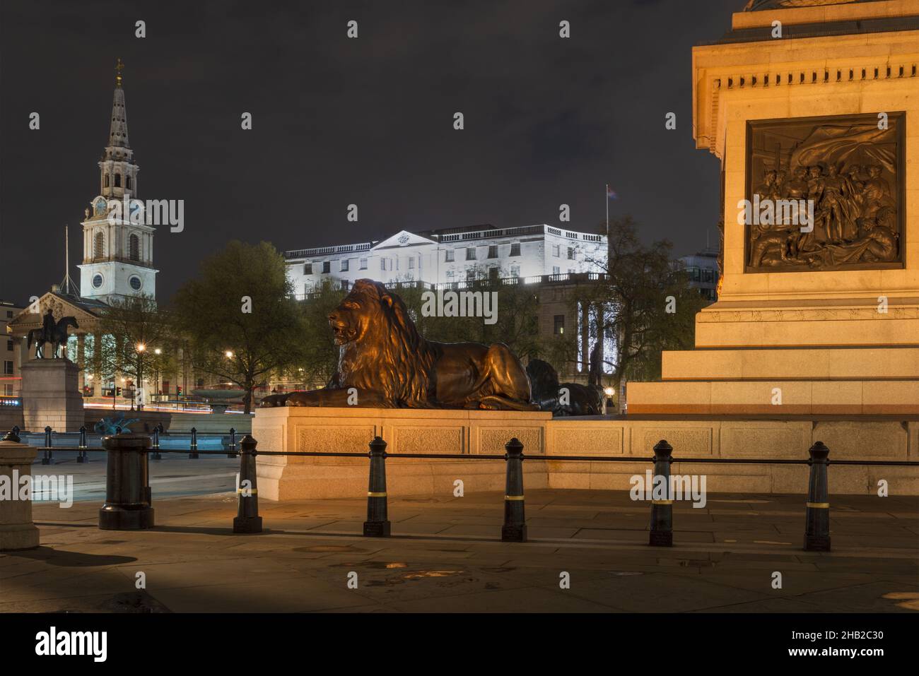 An almost deserted Trafalgar square at night at the end of the covid lockdown in April 2021, London, England, UK Stock Photo