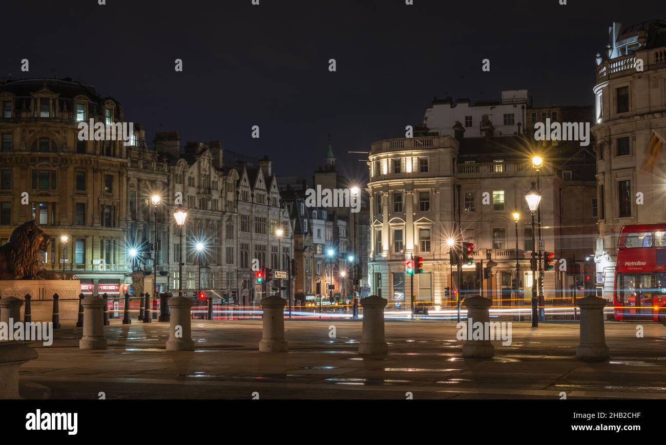 An almost deserted Trafalgar square at night at the end of the covid lockdown in April 2021, London, England, UK Stock Photo