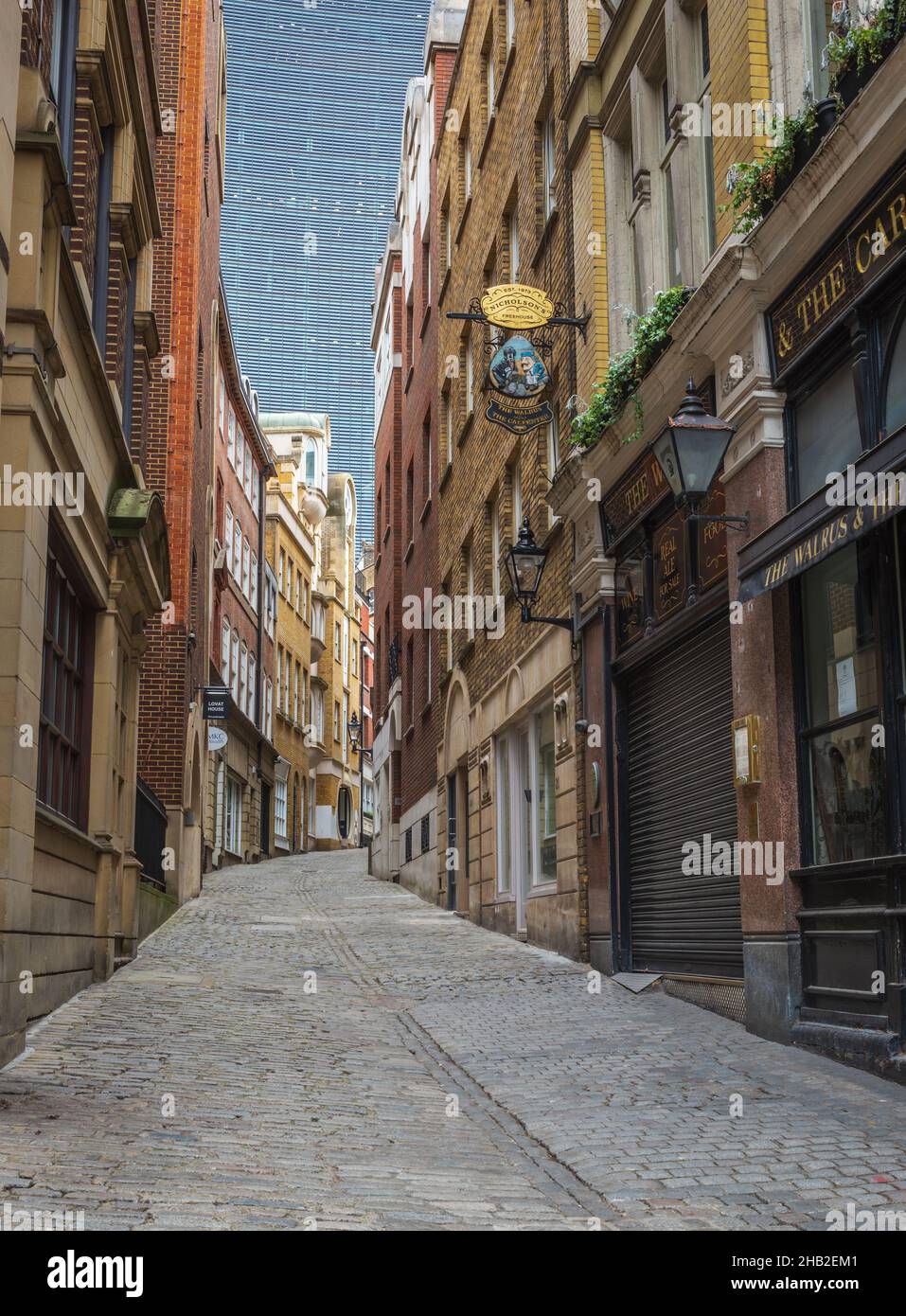 View of cobble stoned Lovat Lane from Walrus and Carpenter pub with the