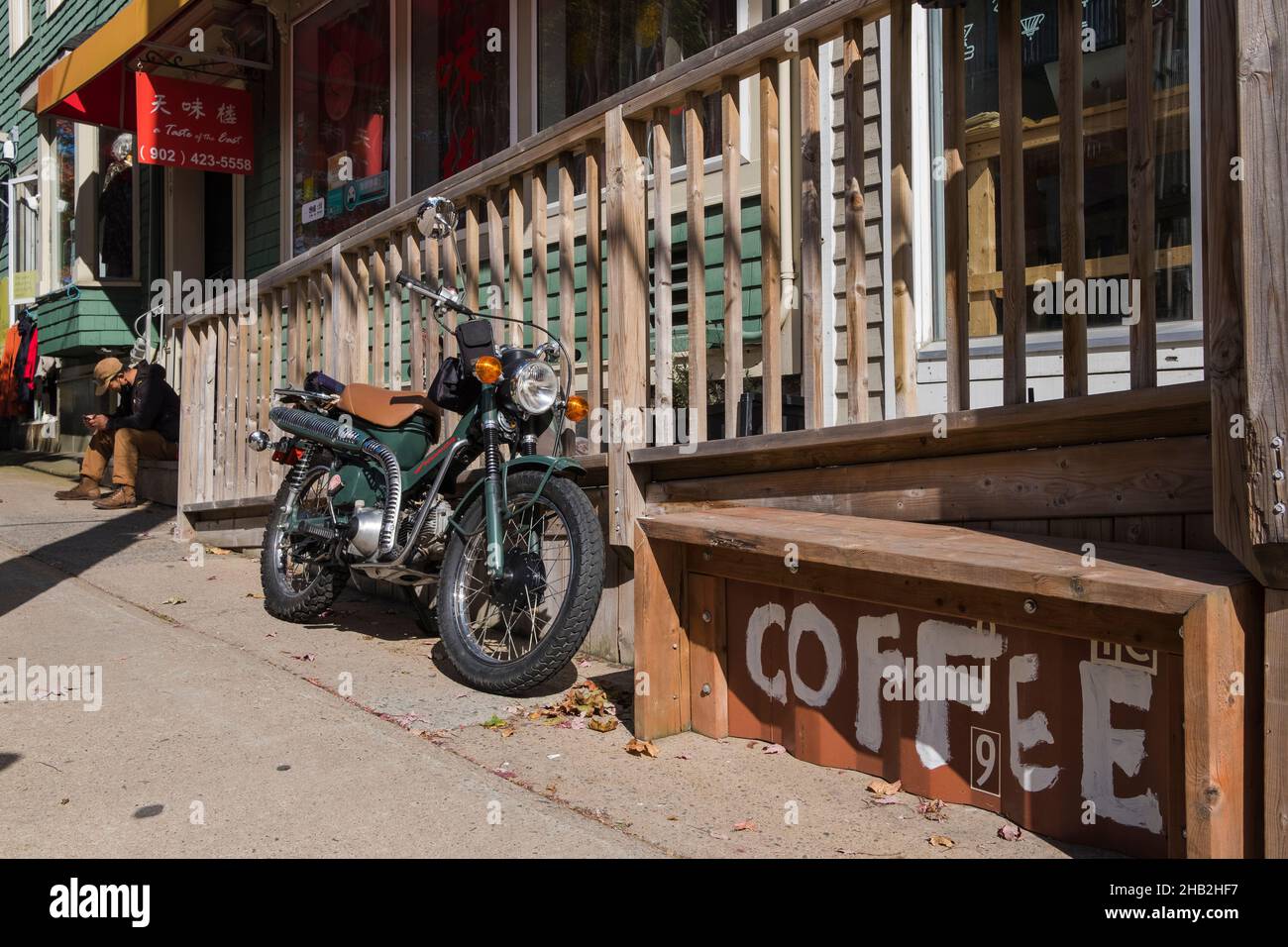 Motorcycle parked in front of a coffee shop, Downtown Halifax, Nova