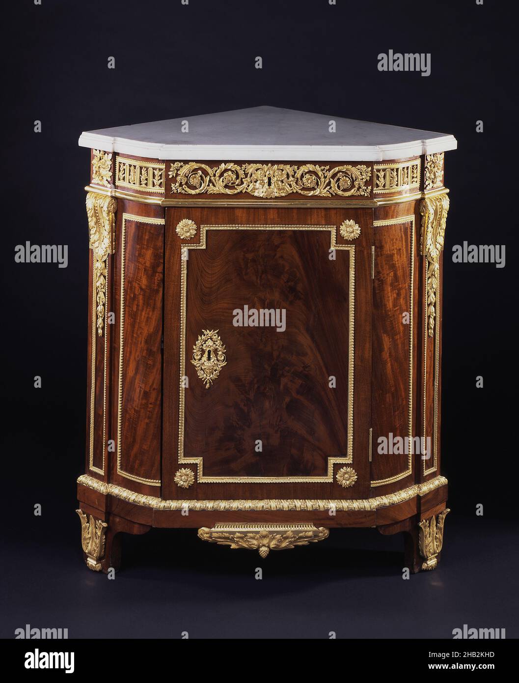 Corner Cabinet, Jean-Henri Riesener, French (born Germany), 1734–1806, 1785, Mahogany, oak, and marble with gilded brass, Made in Paris, Île-de-France, France, Europe, Furniture, 36 13/16 x 35 1/4 x 22 1/16 in. (93.5 x 89.5 x 56 cm Stock Photo