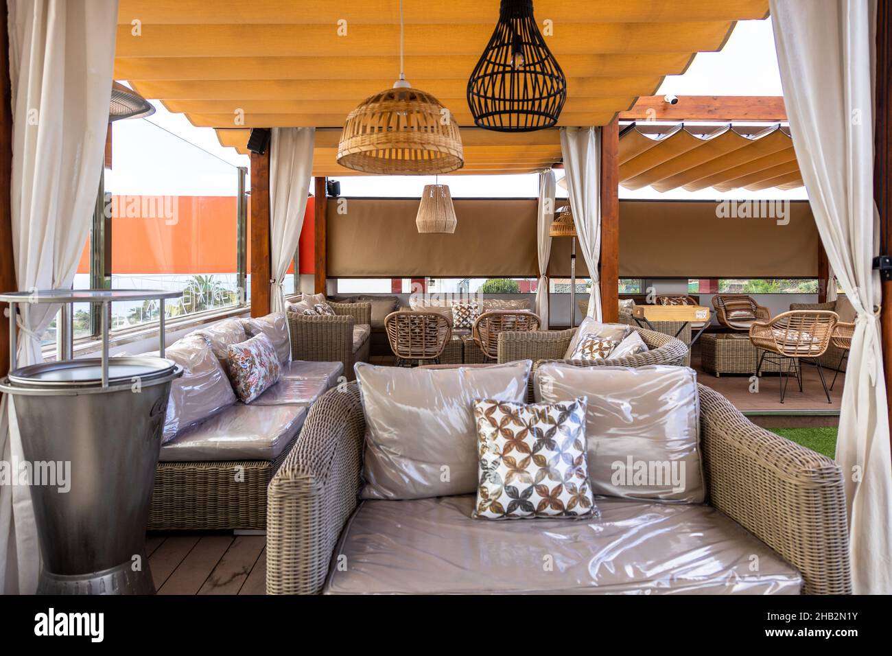 Modern interior of an open-air cafe Stock Photo - Alamy