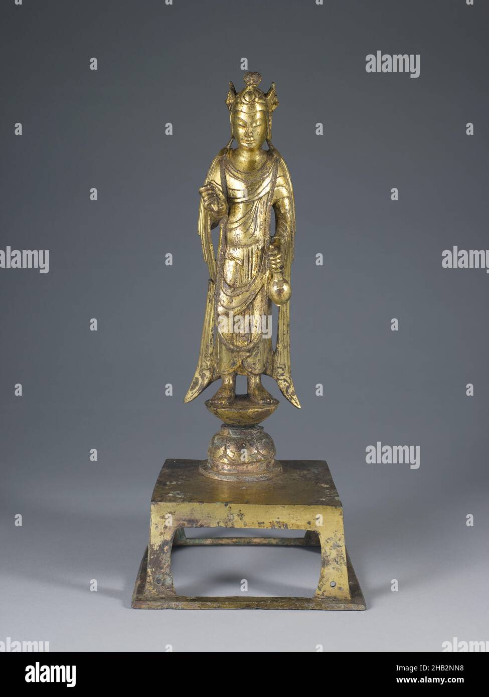 Standing Bodhisattva Avalokiteśvara (Guanyin), Chinese, Sui dynasty, 581–618, late 6th century, Bronze with gilding, Made in China, Asia, Metalwork, sculpture, height of figure and stand: 10 5/8 in. (27 cm Stock Photo