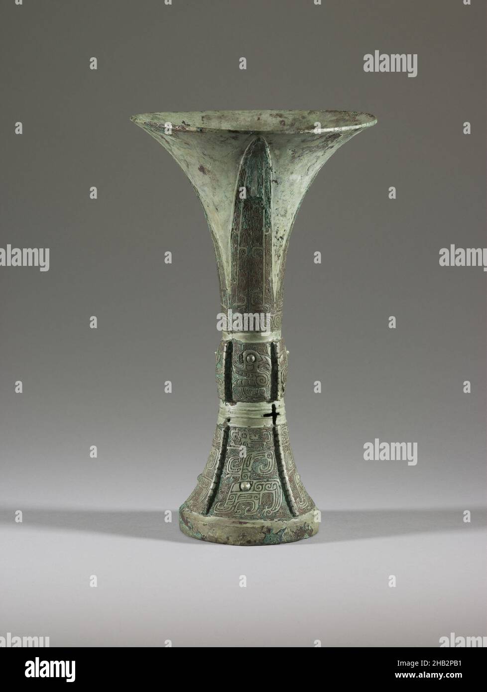 Wine Vessel (gu) with Design of Birds, Dragons, and Spiral Patterns, Chinese, Shang dynasty, 1600–1050 BC, 13th century BC, Bronze, China, Asia, Containers, metalwork, height: 9 5/8 in. (24.4 cm Stock Photo