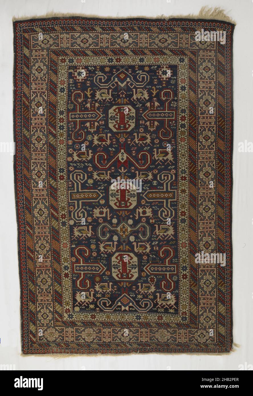 Small Shirvan Carpet with Kufesque Border and 'Perepedil' Pattern, Transcaucasian, late 19th century, Wool, Made in Caucasus, Azerbaijan, Asia, Coverings & hangings, textiles, 78 x 51 in. (198.1 x 129.5 cm Stock Photo