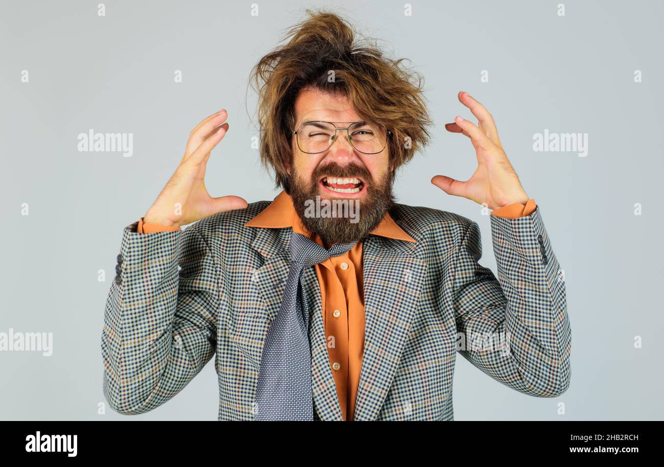 Angry Businessman in suit and glasses. Stressed business man shouting. Boss leader scream concept. Stock Photo