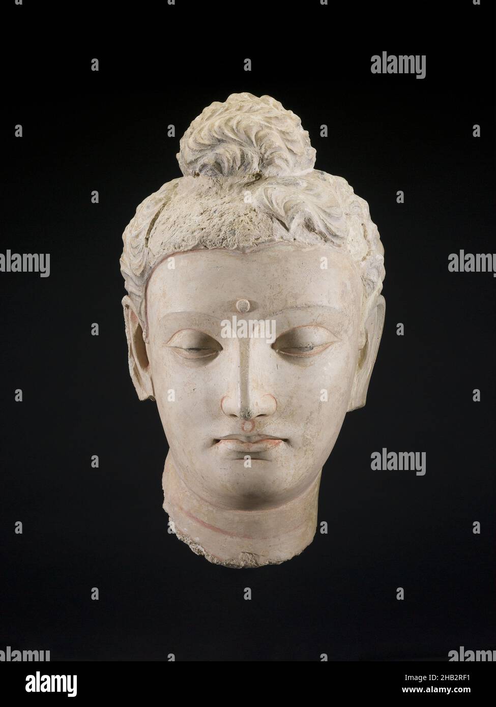 Head of a Buddha, Gandhāran, probably Kidarite dynasty, 3rd–5th century, 4th century, Stucco with traces of pigment, Hadda, Punjab province, Pakistan, Asia, Sculpture, stone & mineral, 18 x 11 1/2 x 10 1/2 in. (45.7 x 29.2 x 26.7 cm Stock Photo