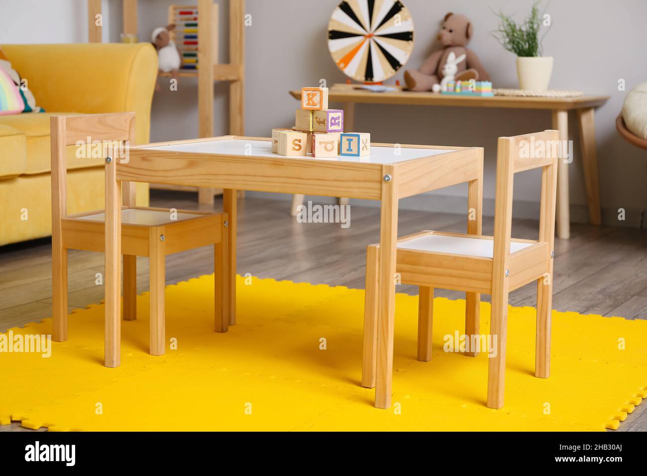 Interior of children's room with table and chairs Stock Photo - Alamy