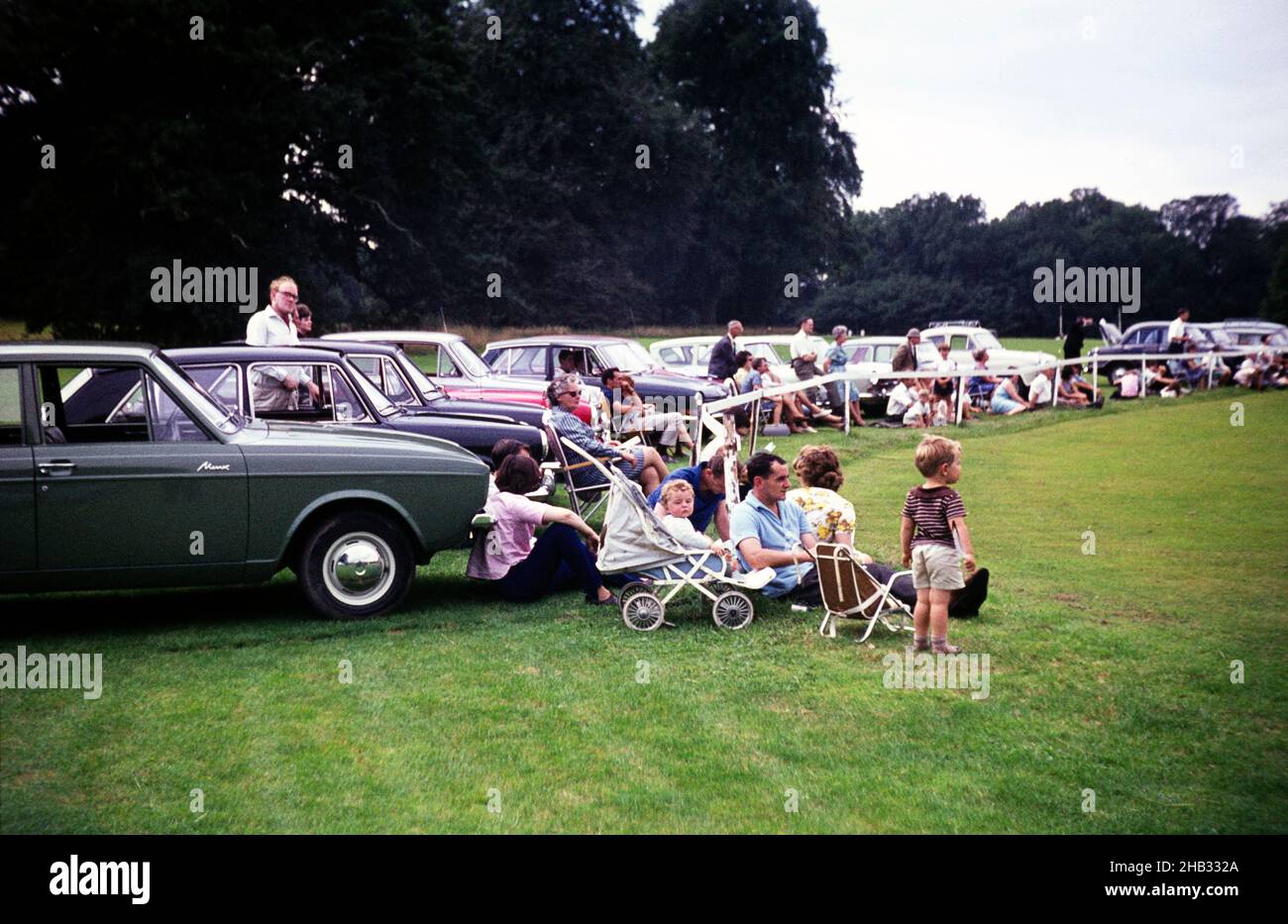 People watching a polo match Cirencester, Gloucestershire, England, UK 1967 sitting by their cars Stock Photo
