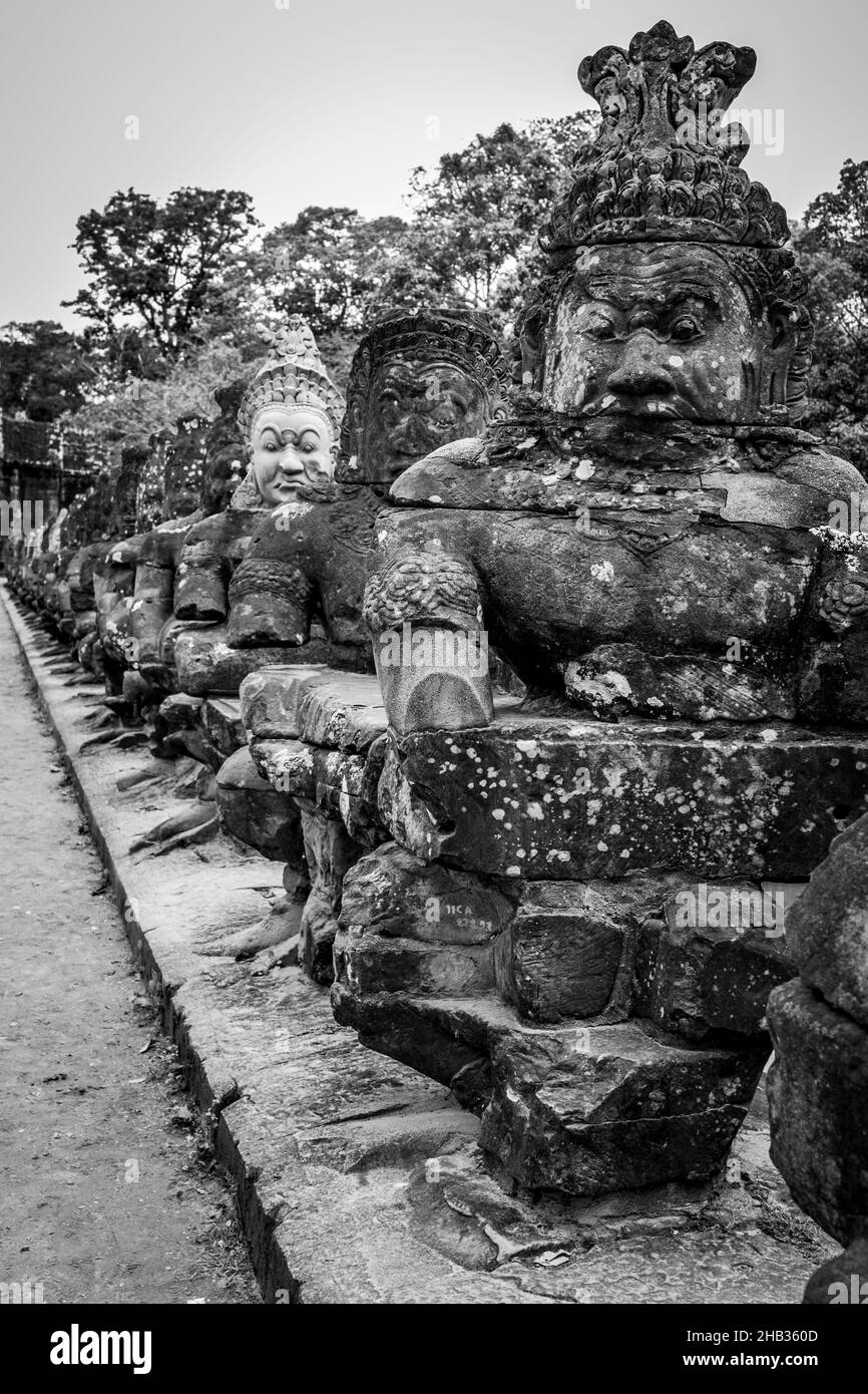 Figures on the bridge Ancient khmer statues in Angkor, Cambodia