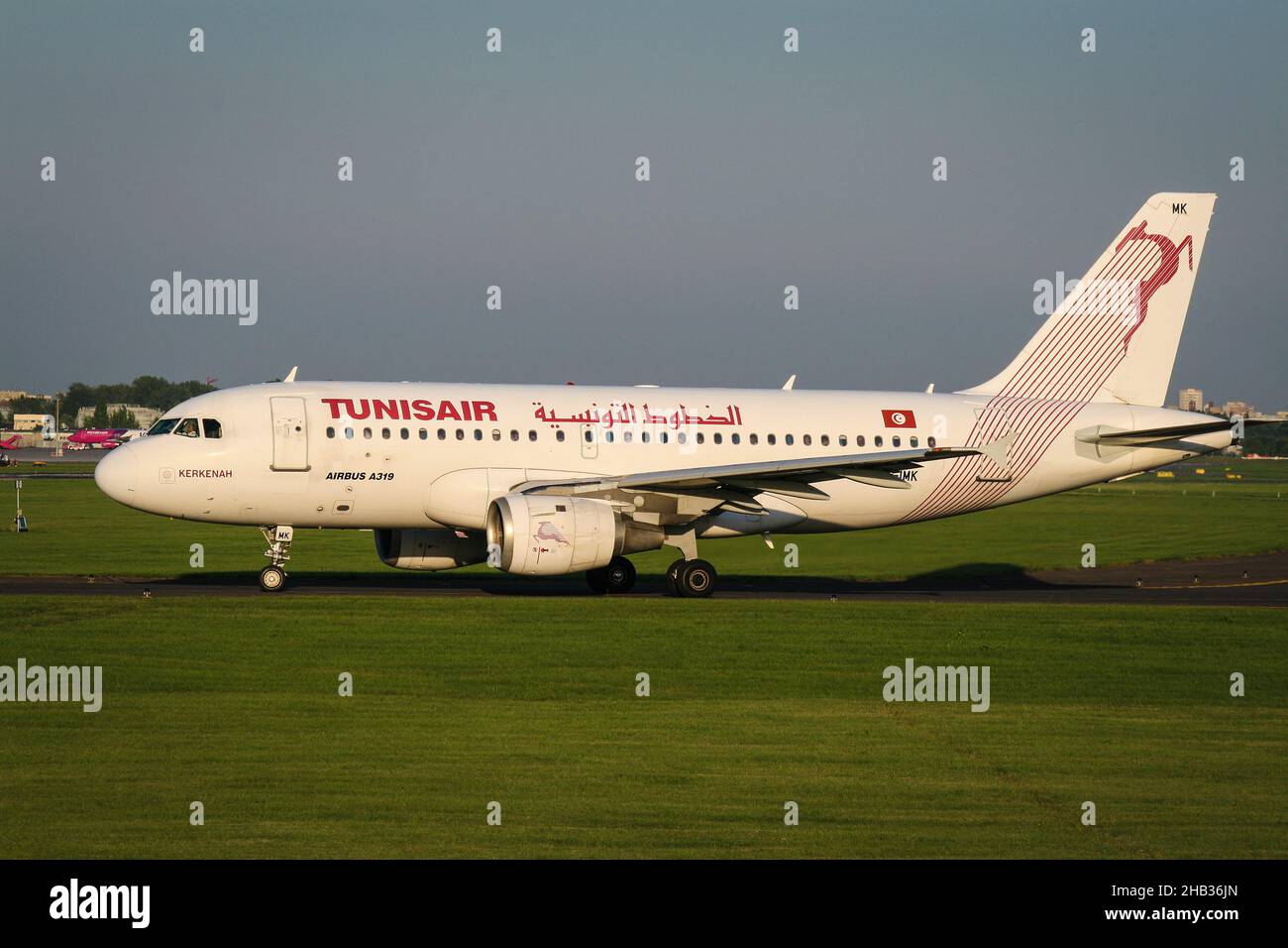 Warsaw, Poland - 07 august 2008: Side view of tunisian airlines Tunisair jet airplane Airbus A319 taxiing on taxiway to the runway Stock Photo