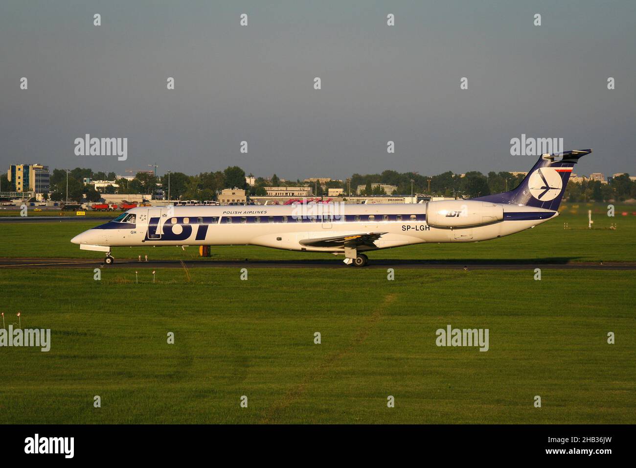 Warsaw, Poland - 07 august 2008: Side view of polish airlines Lot jet airplane Embraer ERJ-145MP taxiing on taxiway to the runway Stock Photo