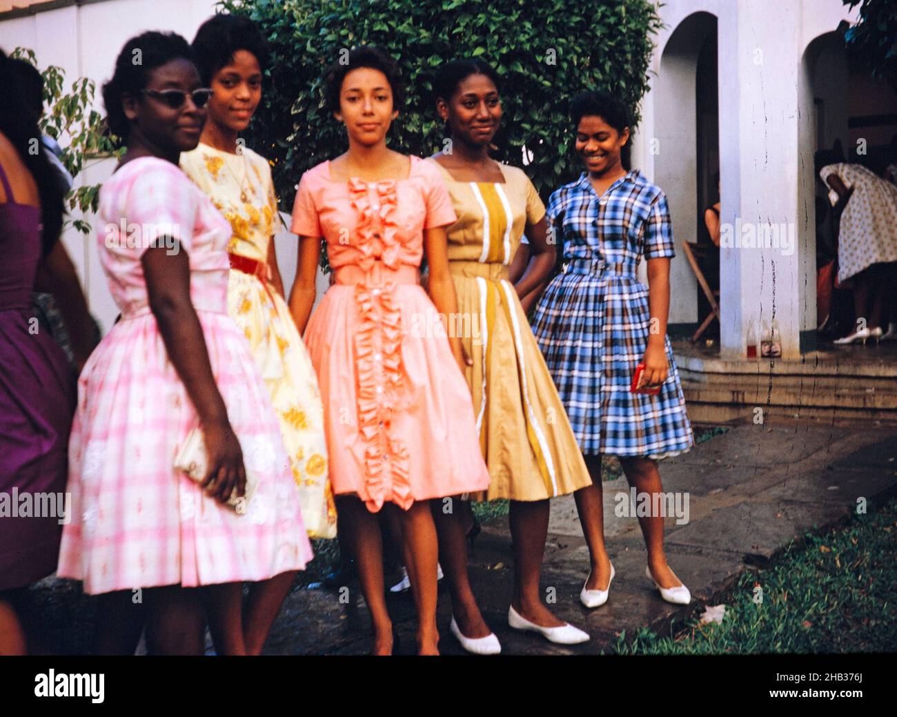 Sixth form girls dressed in pretty dresses for Bazaar Day, Bishop Anstey  high school for girls, Port of Spain, Trinidad 1962 Stock Photo - Alamy