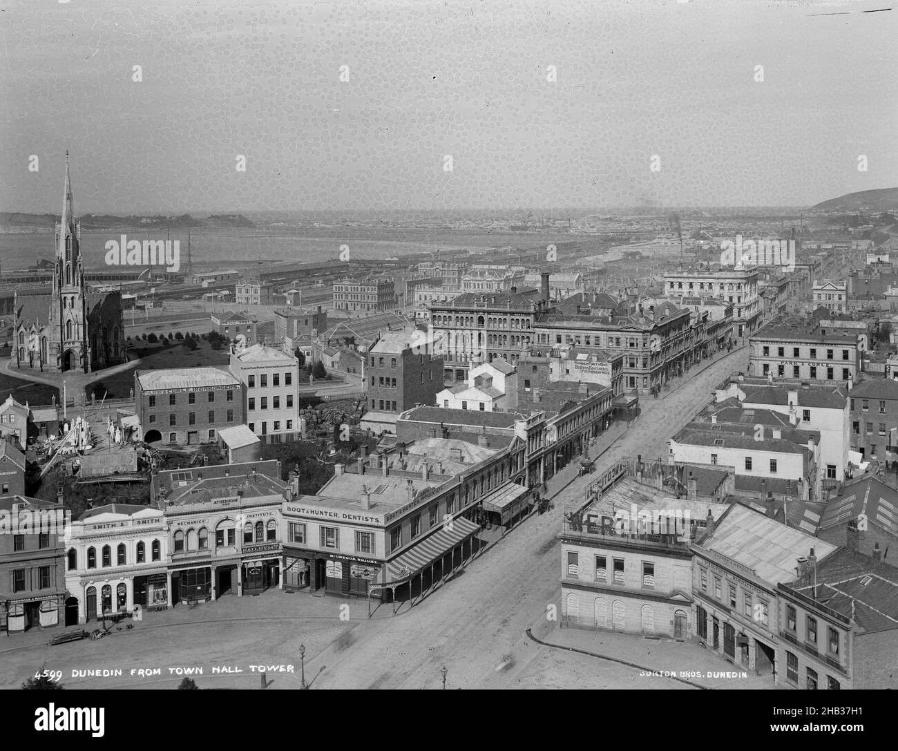 Dunedin from Town Hall Tower, Burton Brothers studio, photography studio, late 1880s, Dunedin, black-and-white photography, South end of Octagon featuring Princes Street. Image centre building Number Forty One Burton Brothers Photographers. Corner Octagon and Princes Street McGregor Wright Picture Frame Maker Stock Photo