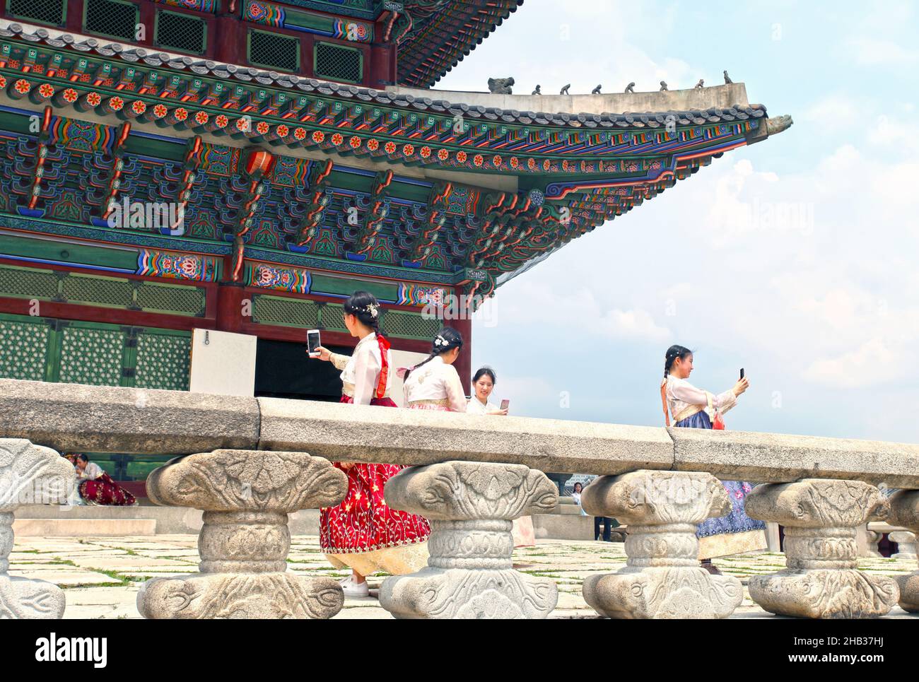 Visitors dressed in Hanbok traditional costumes at the Gyeongbokgung Palace in Seoul, South Korea. Stock Photo