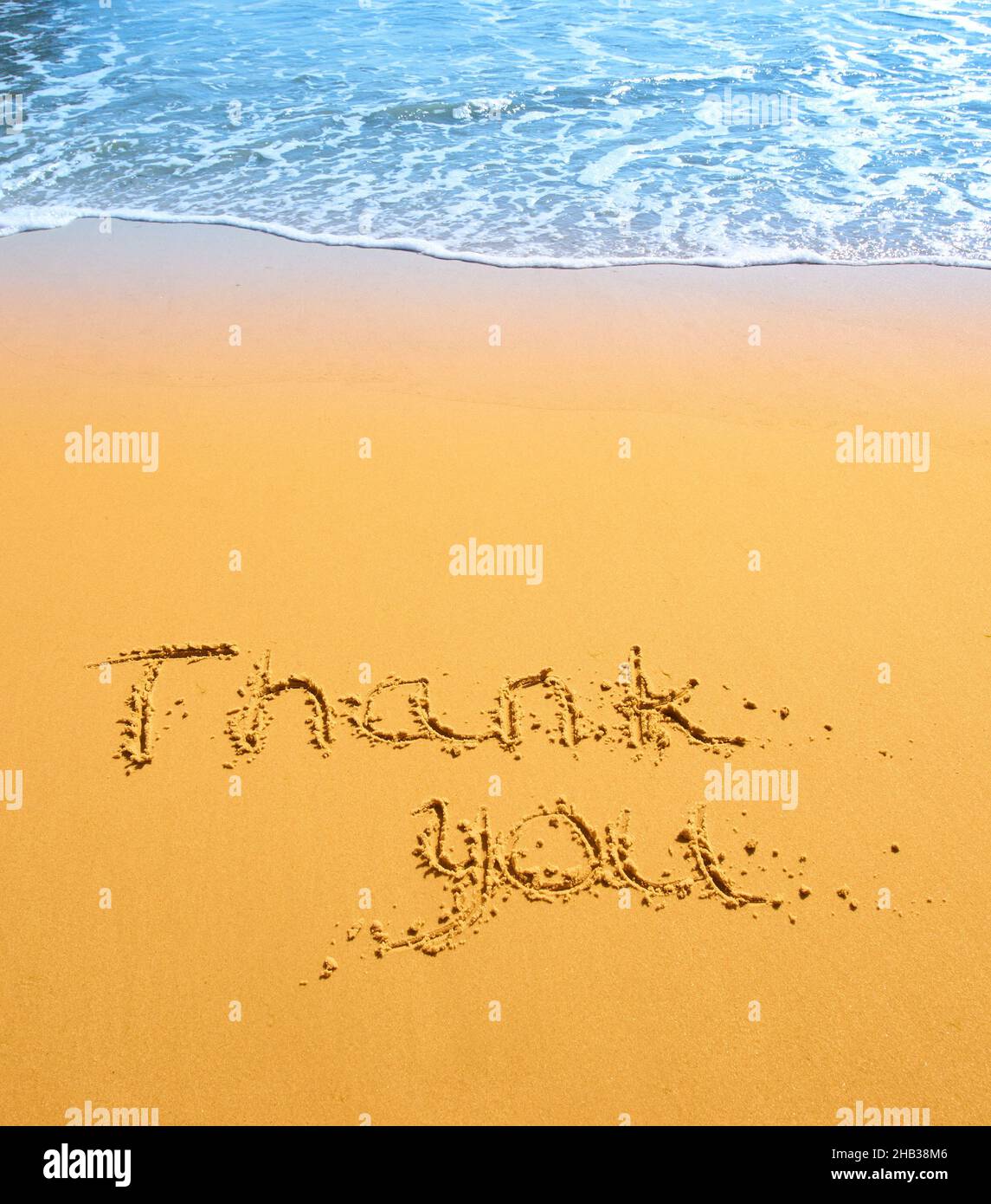 Thank you written in the sand on the beach. conceptual designs Stock ...