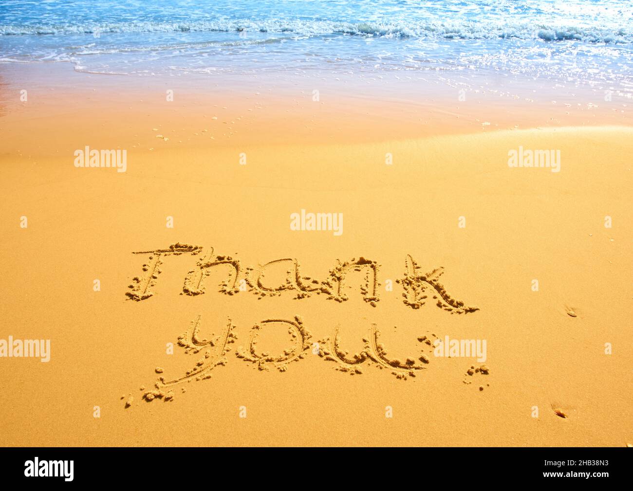 Thank you written in the sand on the beach. conceptual designs Stock ...