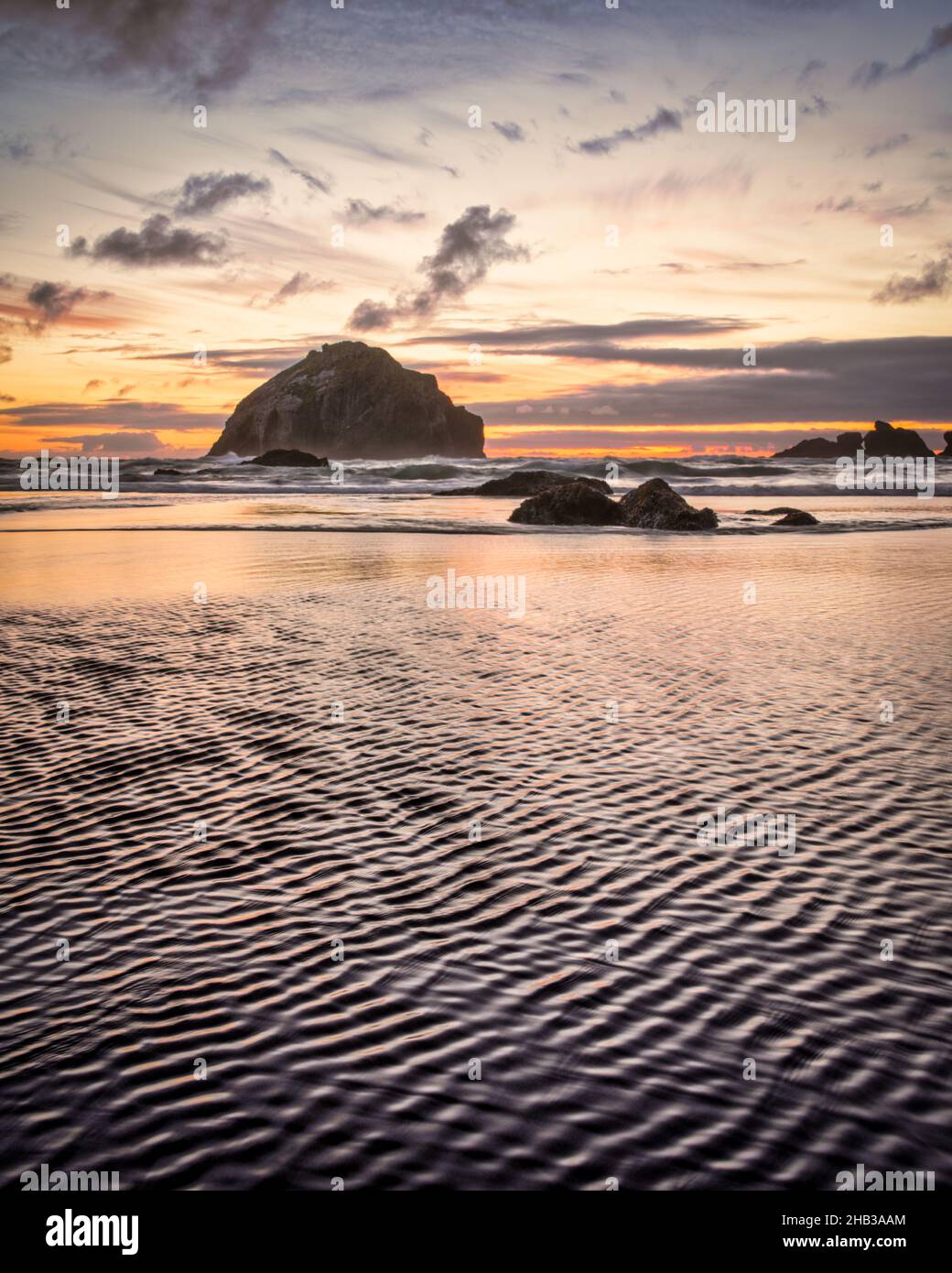 Face Rock Bandon Oregon with closeup of ripples in sand on beach Stock ...