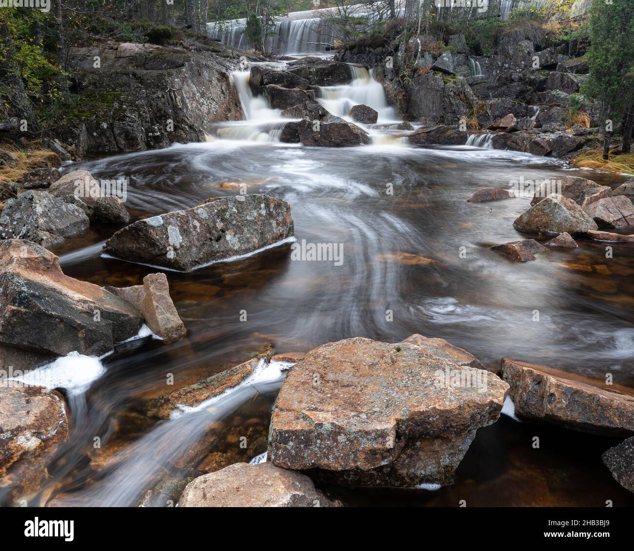 Waterfall flowing over the rocks Stock Photo - Alamy