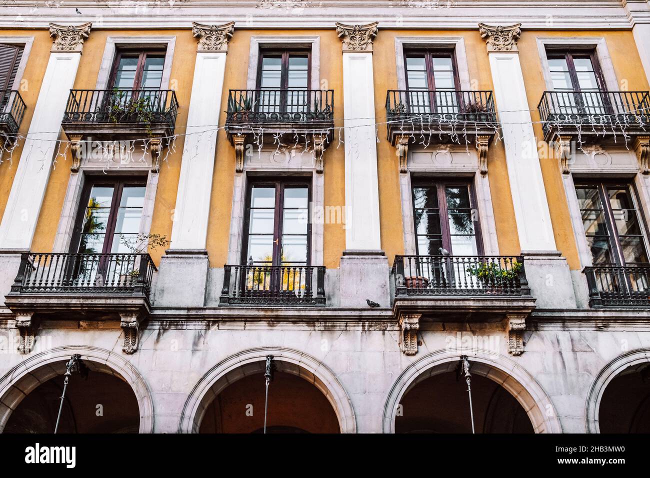 Cityscape of ancient apartment buildings with balconies in old part of