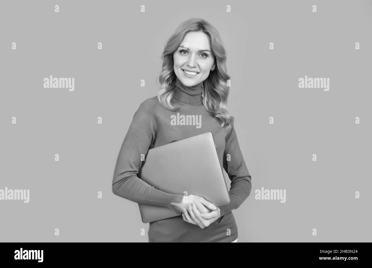 happy woman working online. modern wireless laptop. programmer use pc. girl with laptop. Stock Photo