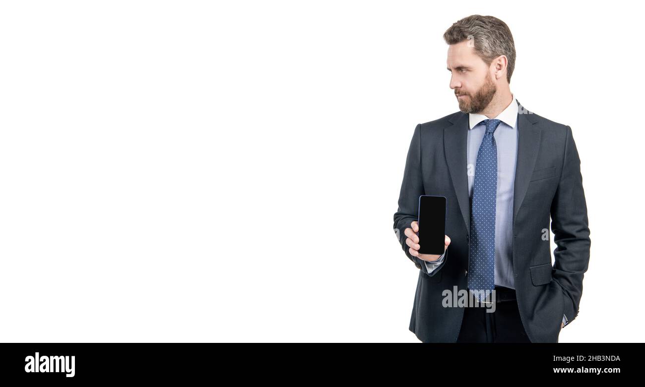 Professional salesperson man in suit hold mobile device isolated on white copy space, phone salesman Stock Photo