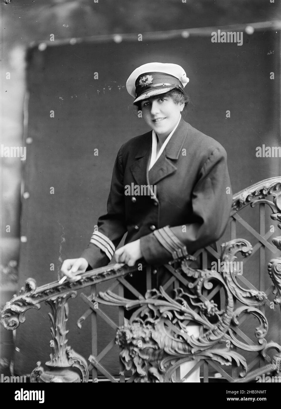 Wright, Berry & Co, photography studio, circa 1920, Wellington, black-and-white photography, Woman in uniform behind ornate bannister Stock Photo