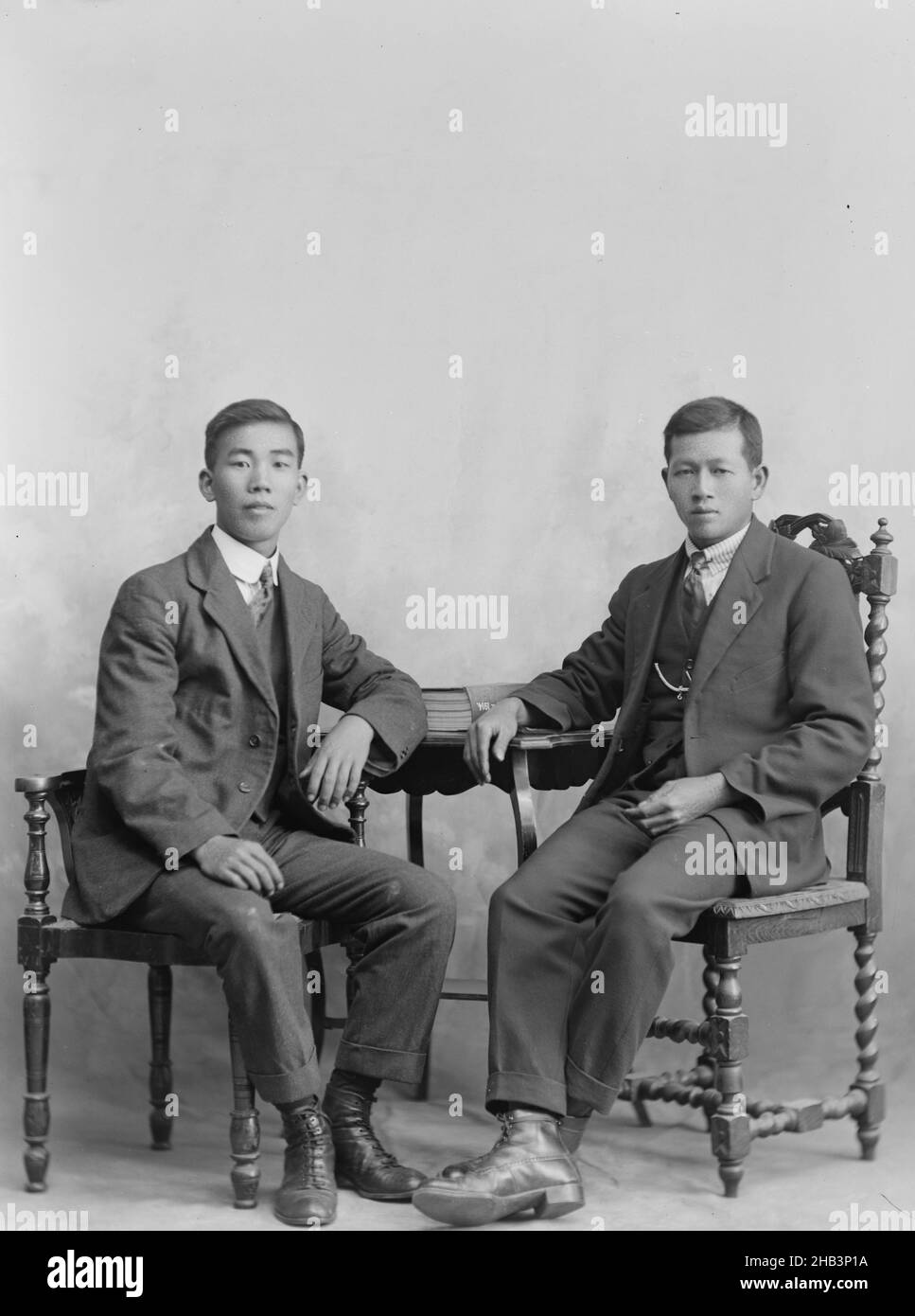 Portrait of two young men, inscribed 'Ng Son', Berry & Co, circa 1920, Wellington Stock Photo