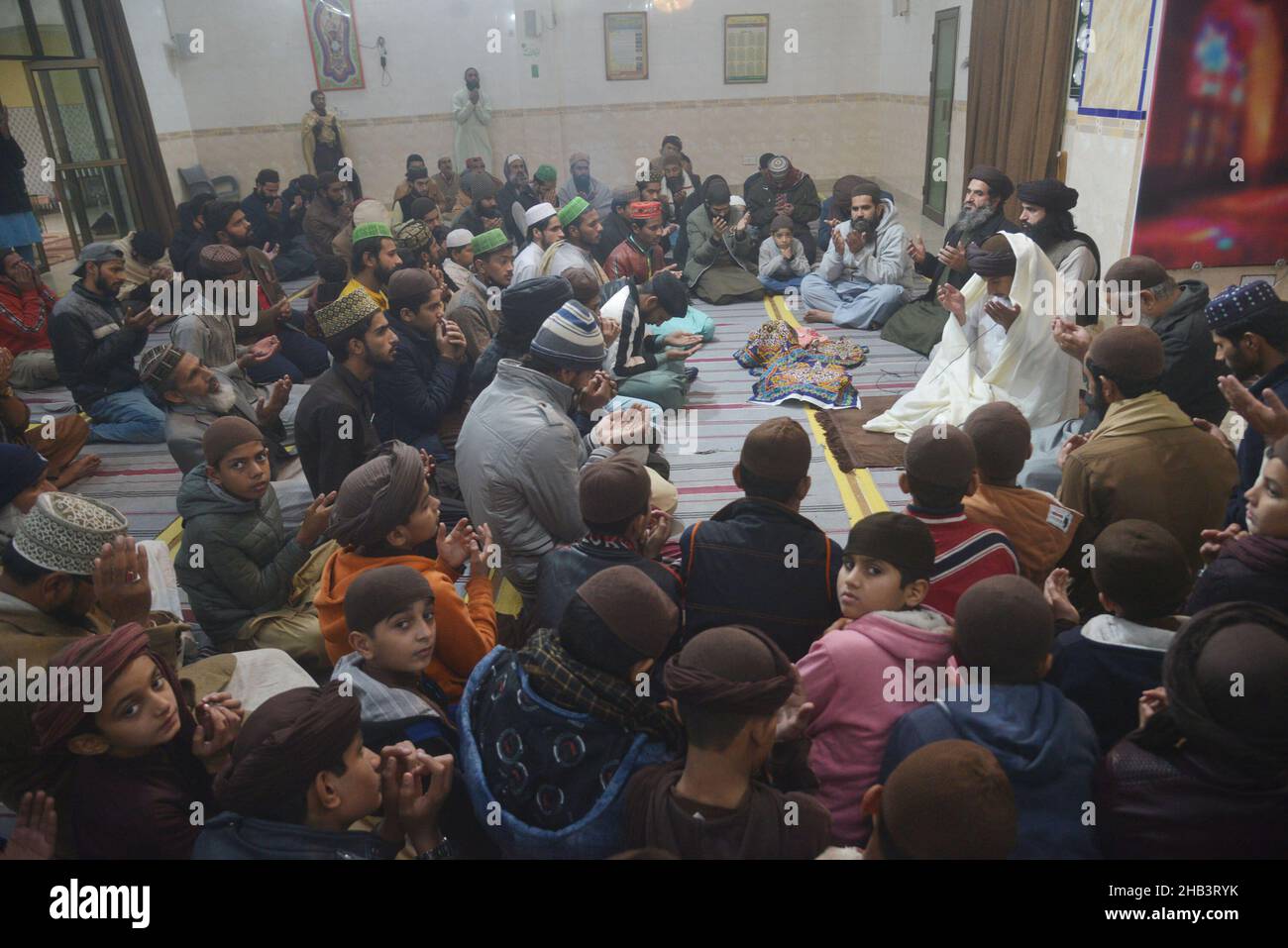 Lahore, Pakistan. 16th Dec, 2021. Leader of Tehreek Labbaik Pakistan (TLP) Hafiz Saad Hussain Rizvi, Hafiz Anas Hussain Rizvi and students are reciting holy Quran, offering prayer during in the remembrance of the Martyrs Teachers and Students of Army Public School (APS) Peshawar incident, at Masjid Rehmat ul lil Alameen in Lahore. An attack on the Army Public School (APS) in the city of Peshawar, where more than 150 students were killed when Taliban gunmen overran. (Photo by Rana Sajid Hussain/Pacific Press) Credit: Pacific Press Media Production Corp./Alamy Live News Stock Photo