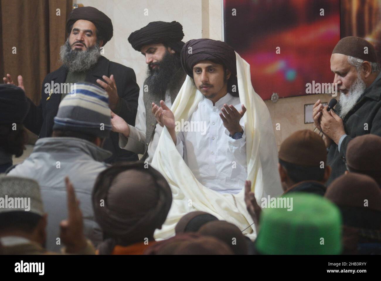 Lahore, Pakistan. 16th Dec, 2021. Leader of Tehreek Labbaik Pakistan (TLP) Hafiz Saad Hussain Rizvi, Hafiz Anas Hussain Rizvi and students are reciting holy Quran, offering prayer during in the remembrance of the Martyrs Teachers and Students of Army Public School (APS) Peshawar incident, at Masjid Rehmat ul lil Alameen in Lahore. An attack on the Army Public School (APS) in the city of Peshawar, where more than 150 students were killed when Taliban gunmen overran. (Photo by Rana Sajid Hussain/Pacific Press) Credit: Pacific Press Media Production Corp./Alamy Live News Stock Photo