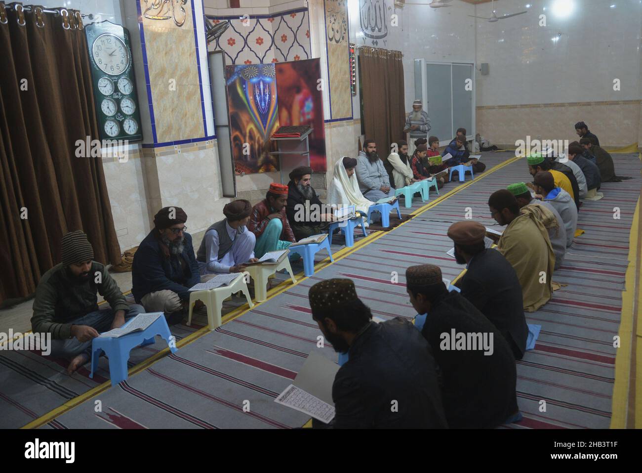 Lahore, Pakistan. 16th Dec, 2021. Leader of Tehreek Labbaik Pakistan (TLP) Hafiz Saad Hussain Rizvi, Hafiz Anas Hussain Rizvi and students are reciting holy Quran, offering prayer during in the remembrance of the Martyrs Teachers and Students of Army Public School (APS) Peshawar incident, at Masjid Rehmat ul lil Alameen in Lahore. An attack on the Army Public School (APS) in the city of Peshawar, where more than 150 students were killed when Taliban gunmen overran. (Photo by Rana Sajid Hussain/Pacific Press) Credit: Pacific Press Media Production Corp./Alamy Live News Stock Photo