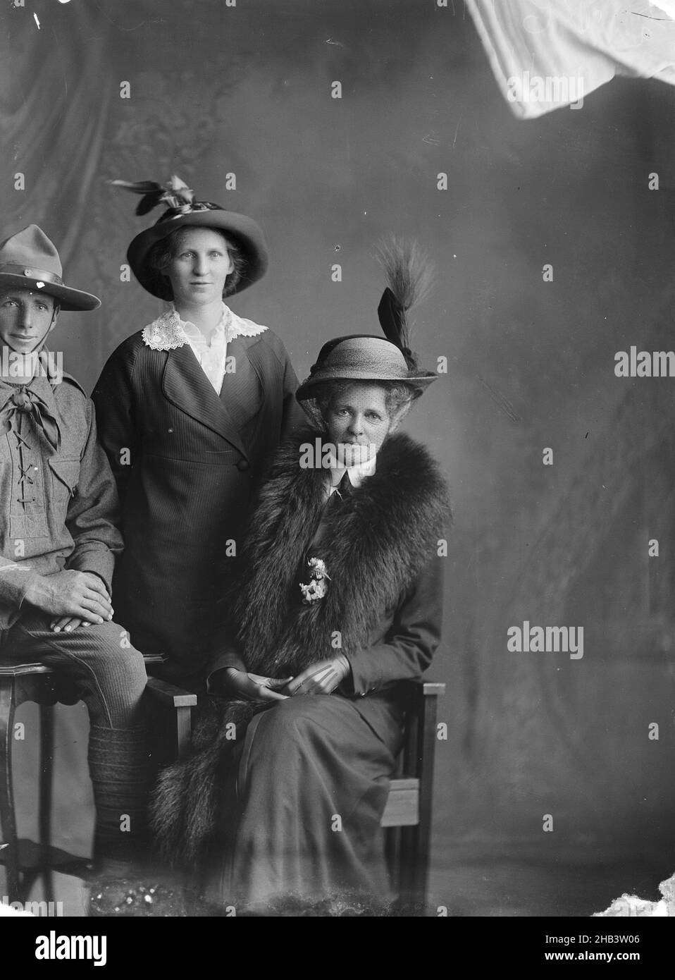 Thomas Henry Mossman, Esther Muriel Mossman and Marion Susan Mossman, Berry & Co, photography studio, 1914, Wellington, black-and-white photography, The man in this portrait is Thomas Henry Mossman,  service number 9/728  and the women are his sister Esther Muriel Mossman (standing) and his stepmother Marion Susan Mossman Stock Photo