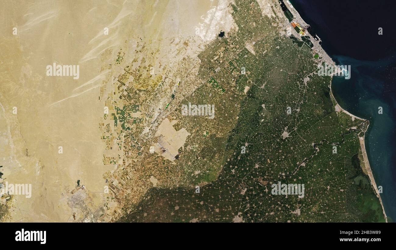 Aerial of the Sahara Desert and the port of Alexandria, Egypt on the western edge of the Nile River Delta Stock Photo