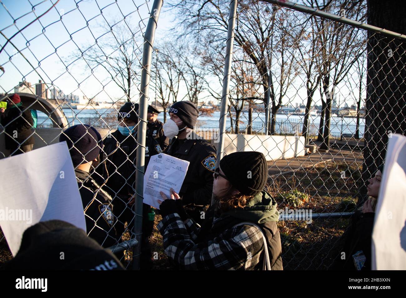 New York, USA. 12th Dec, 2021. Protesters hold the temporary