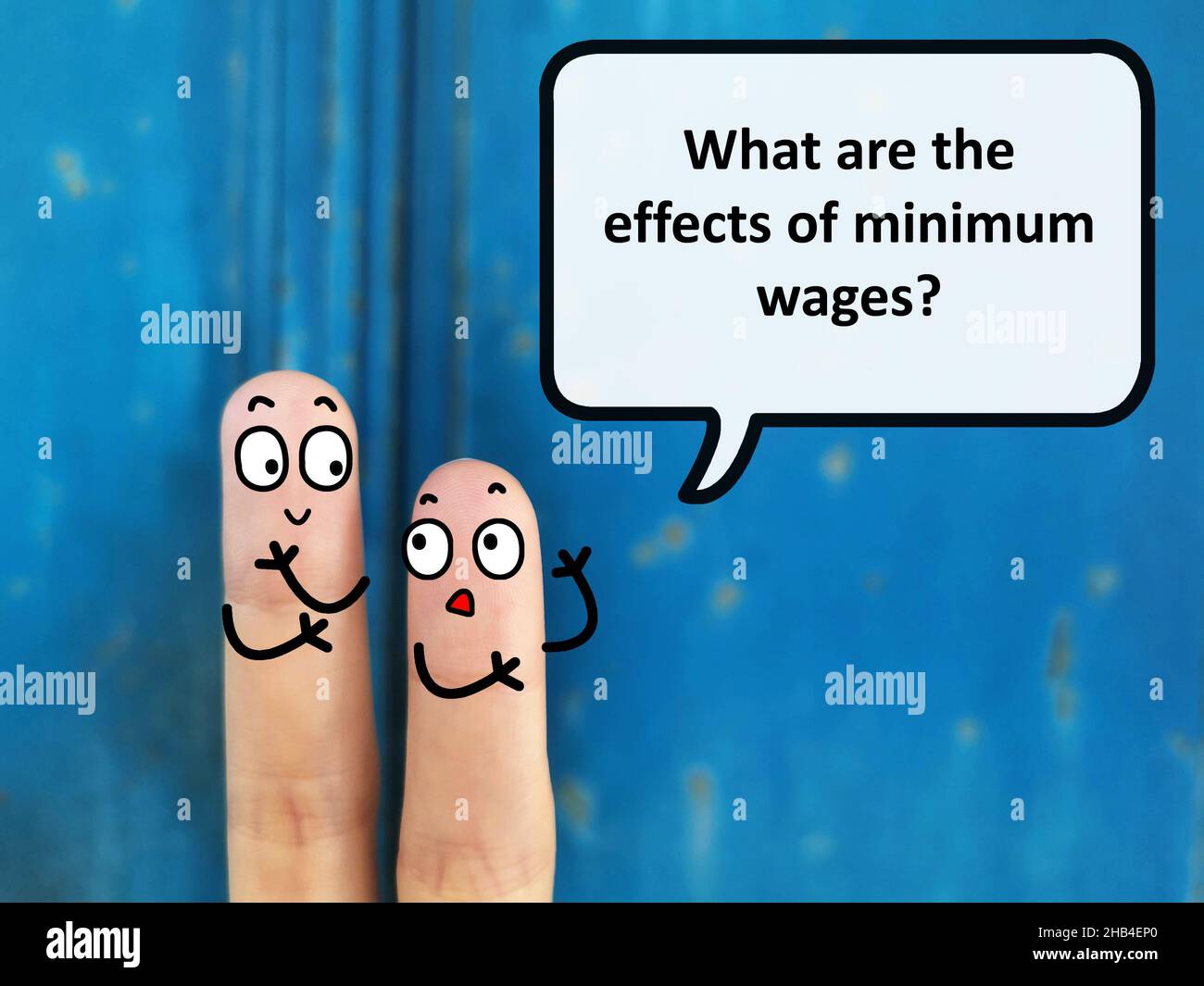 Two fingers are decorated as two person. They are discussing about